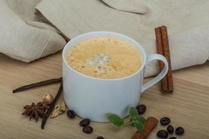 Coffee on wooden background photo