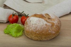 Bread on wooden background photo