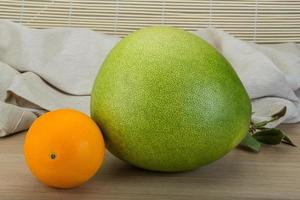 Green pomelo and orange photo