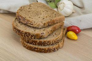 Cereal bread on wooden background photo