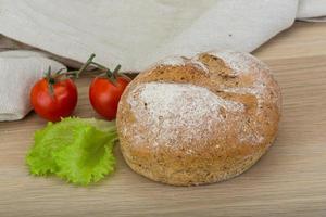 Bread on wooden background photo