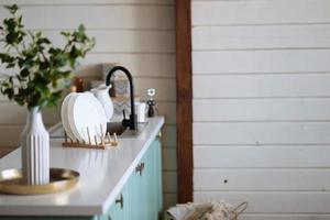 Table board and defocused modern kitchen background. photo
