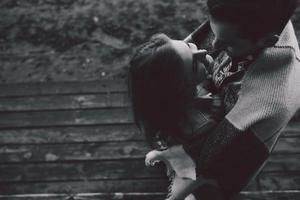 Young couple wrapped in plaid photo