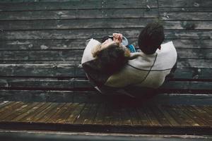 Young couple wrapped in plaid photo