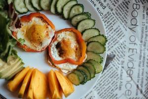 Breakfast with fried egg, vegetables, selective focus photo