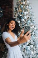 Woman Making Video Message or Selfie Concept of Holidays. photo