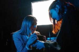 Woman and woman fortune teller with crystal ball photo