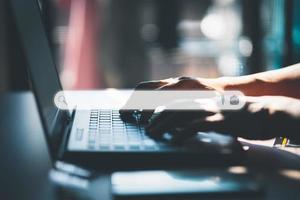 Man using laptop in the room for searching browsing internet data information. Business concept for Using search with your website. photo