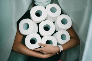 People are stocking up toilet paper for home quarantine from crownavirus. photo