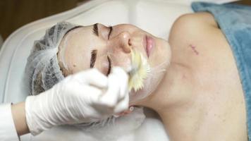 Young pretty woman receiving treatments in beauty salons. photo