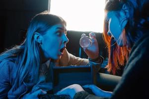 Woman and woman fortune teller with crystal ball photo