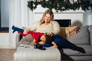 Lively mother tickling little daughter enjoy free time active weekend photo