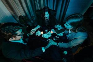 People hold hands of night at table with candles photo