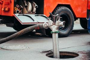 Fire Hydrant In Use During a Structure Fire photo