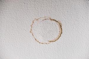 Water damaged ceiling roof and wall, leakage brown stain in an old office building photo