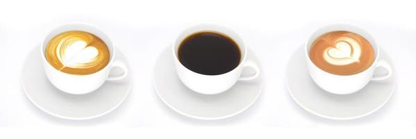 A row of 3 coffee cups full of smooth Americano on a white table with foams and shapes of leaf and heart