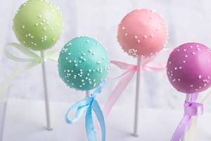 Colorful cake pops on a blurred background photo