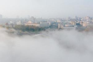 Aerial view of the city in the fog photo