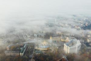 Aerial view of the city in the fog photo