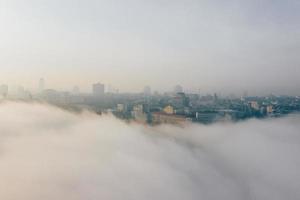 Aerial view of the city in the fog photo