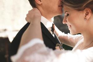 bride and groom posing on the streets photo