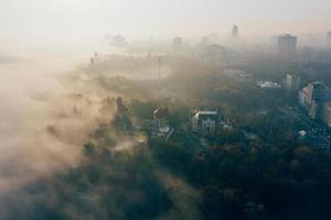 Aerial view of the city in the fog photo