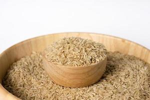 Raw brown rice in a bowl. Selective focus. photo