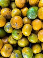 Yellow citrus fruit in supermarket photo