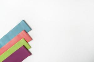 Colorful fitness bands lying on a white background photo