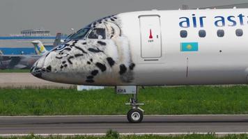 ALMATY, KAZAKHSTAN MAY 4, 2019 - Air Astana Embraer E 190 E2 P4 KHA in special Snow leopard livery, taxiing after landing, Almaty International Airport, Kazakhstan