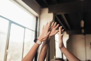 Women giving five each other after having a great workout in gym. photo