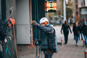 Worker climber preparing for work at height. photo