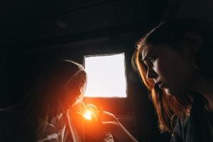 Woman and woman fortune teller with crystal ball photo