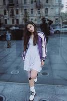 Young girl posing with on the office building terrace. photo