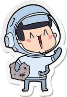 sticker of a happy cartoon astronaut with moon rock vector