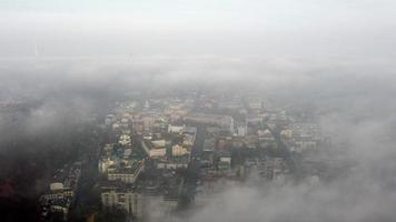 Aerial view of the city in the fog photo