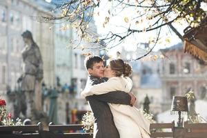 bride and groom in center of the old town photo