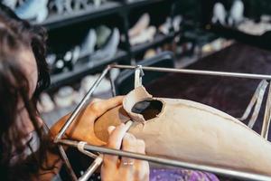 Portrait of young woman enjoying favorite job in workshop. photo