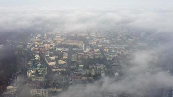 Aerial view of the city in the fog photo