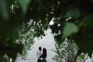 man and woman at the lake photo