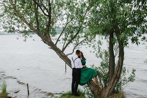 man and woman at the lake photo