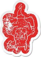 cartoon distressed sticker of a dog wearing santa hat vector