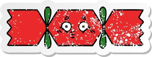 distressed sticker of a cute cartoon christmas cracker vector