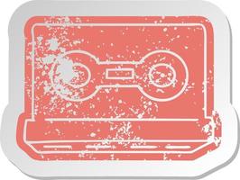 distressed old sticker of a retro cassette tape vector