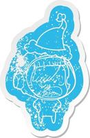 cartoon distressed sticker of a astronaut woman explaining wearing santa hat vector