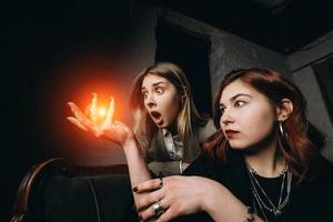 Woman and woman fortune teller with crystal ball photo