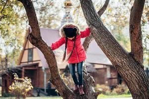 Little Girl to climb a tree photo