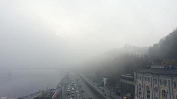 A city covered in fog. City traffic, aerial view photo