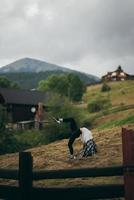 Brunette woman doing exercise while working out at countryside photo