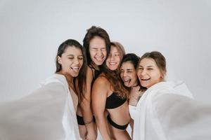Diverse models wearing comfortable underwear take selfie photo